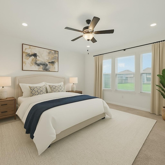 bedroom featuring light colored carpet, ceiling fan, baseboards, and recessed lighting