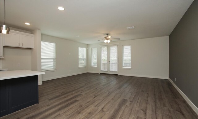 910 W 21st St Unit B, Houston, TX 77008 - unfurnished living room featuring ceiling fan, baseboards, and dark wood-style floors