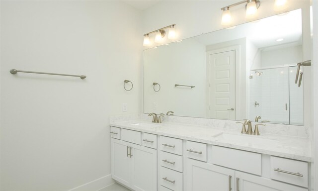 910 W 21st St Unit B, Houston, TX 77008 - full bathroom with a shower stall, double vanity, baseboards, and a sink
