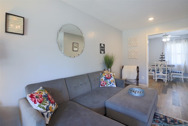 living area with ceiling fan, wood finished floors, and recessed lighting