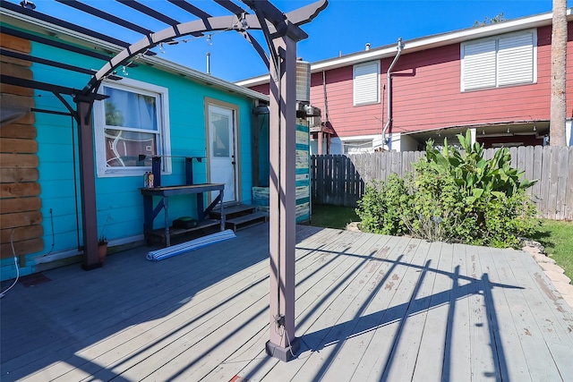 deck with a pergola and fence