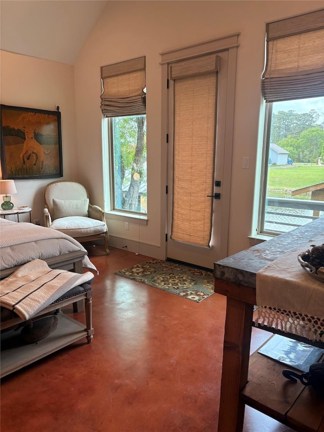 10 Hunters Creek Dr, Huntsville, TX 77340 - living area featuring finished concrete floors and vaulted ceiling