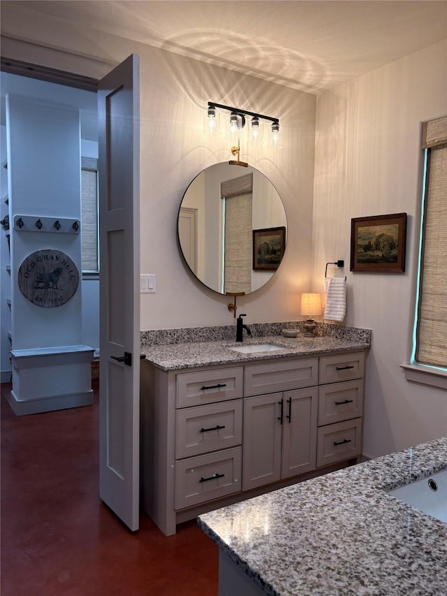 bathroom with vanity and finished concrete floors