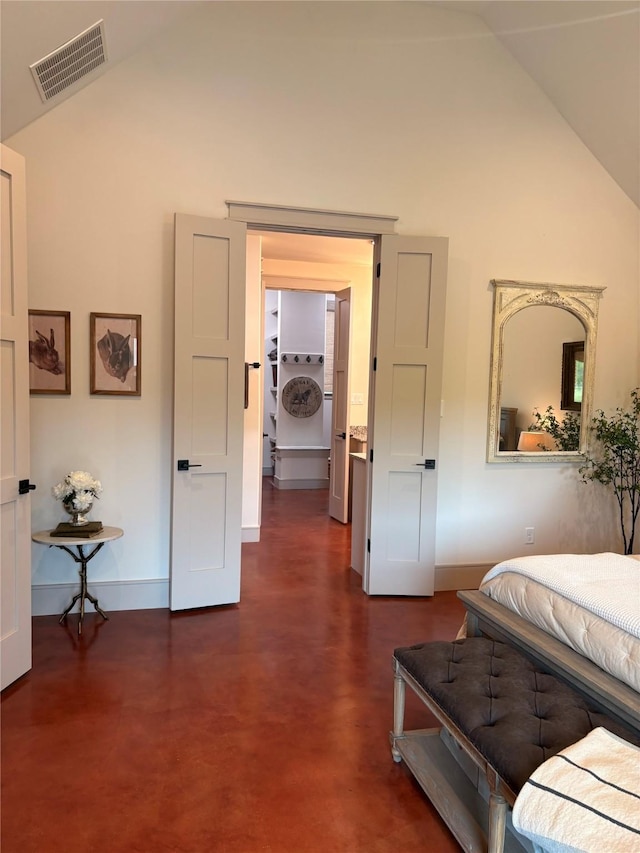bedroom featuring baseboards, visible vents, and high vaulted ceiling