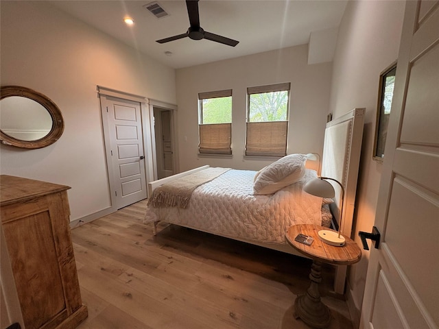 10 Hunters Creek Dr, Huntsville, TX 77340 - bedroom with light wood finished floors, ceiling fan, and recessed lighting