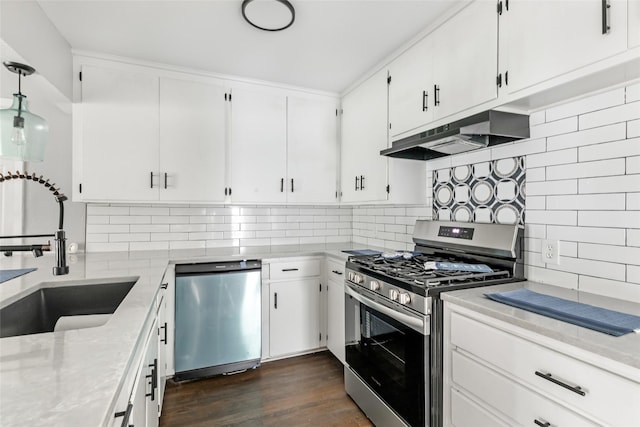 11610 Lane St, Houston, TX 77029 - kitchen with decorative backsplash, white cabinets, a sink, stainless steel appliances, and under cabinet range hood
