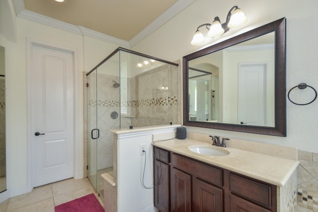 bathroom featuring vanity, ornamental molding, a stall shower, and tile patterned flooring
