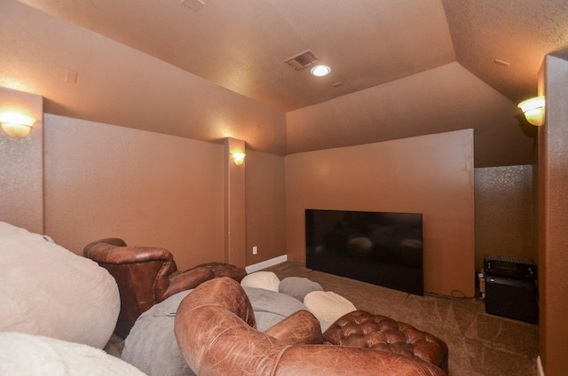 home theater with visible vents, carpet flooring, and lofted ceiling