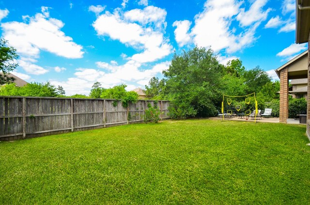 view of yard with a fenced backyard and a patio