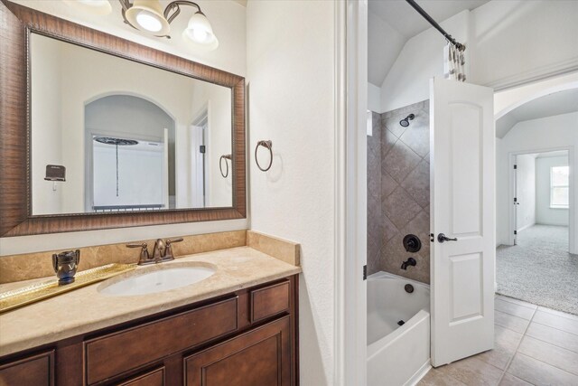 27 Tioga Pl, The Woodlands, TX 77375 - full bath featuring vanity, shower / bathtub combination with curtain, tile patterned floors, and lofted ceiling