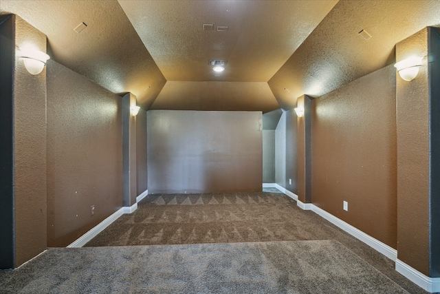 27 Tioga Pl, The Woodlands, TX 77375 - bonus room with carpet floors, a textured wall, a textured ceiling, and baseboards
