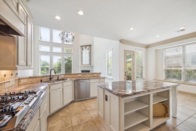 27 Tioga Pl, The Woodlands, TX 77375 - kitchen with appliances with stainless steel finishes, custom exhaust hood, a sink, stone countertops, and a chandelier