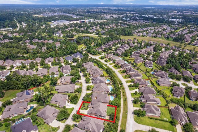 27 Tioga Pl, The Woodlands, TX 77375 - aerial view of residential area featuring property parcel outlined