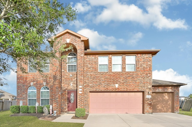 2606 Howlite Ln, Rosharon, TX 77583 - view of front facade featuring brick siding, concrete driveway, and fence