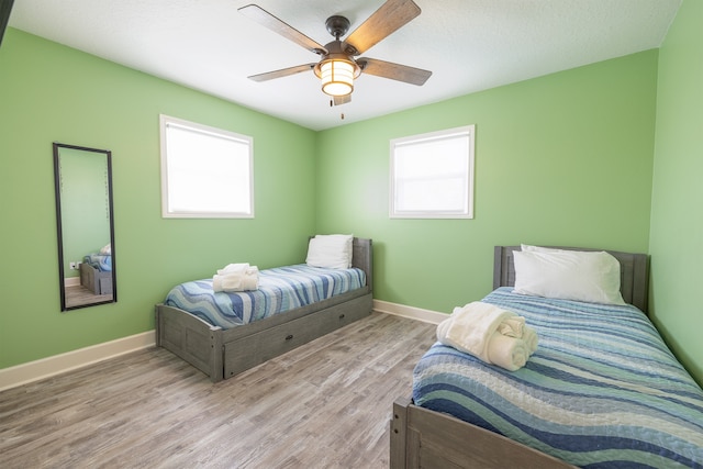 4206 Seabird Dr, Galveston, TX 77554 - bedroom with wood finished floors and ceiling fan