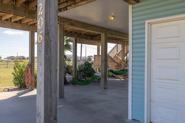 4206 Seabird Dr, Galveston, TX 77554 - view of patio featuring stairway