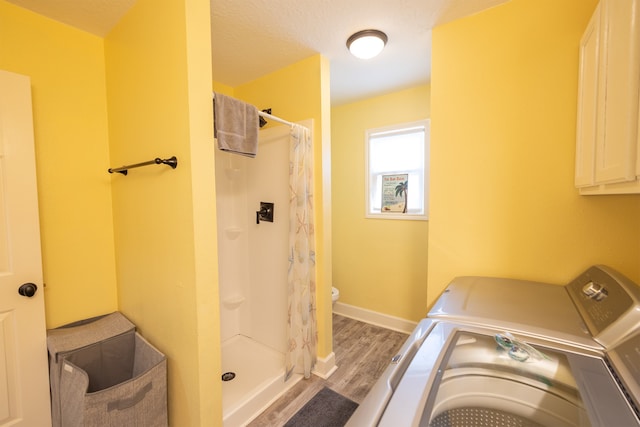 4206 Seabird Dr, Galveston, TX 77554 - laundry room with washing machine and dryer and light wood finished floors