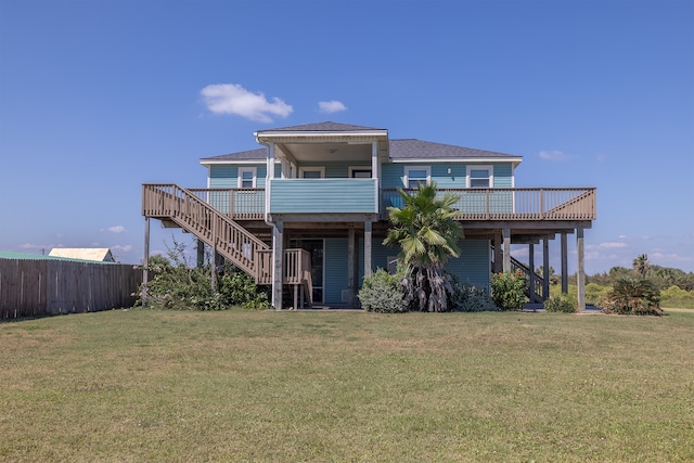 4206 Seabird Dr, Galveston, TX 77554 - rear view of house with a wooden deck, stairway, and a shingled roof
