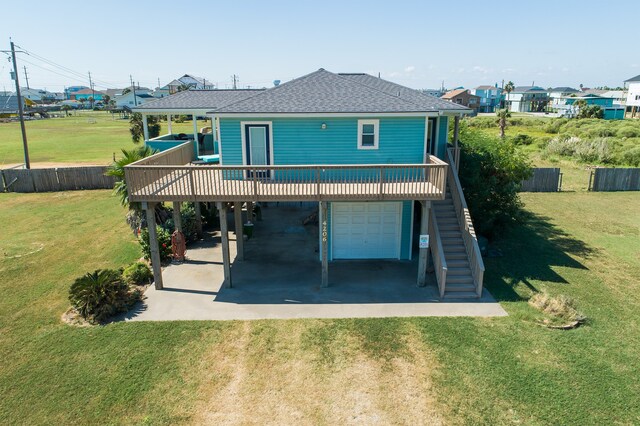 4206 Seabird Dr, Galveston, TX 77554 - back of house with stairway, roof with shingles, a deck, an attached garage, and a carport