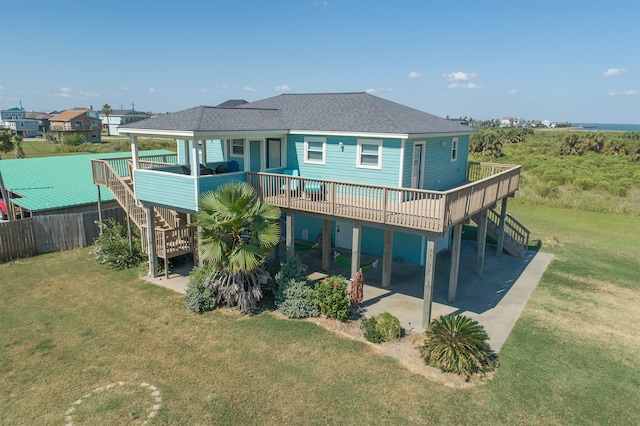 4206 Seabird Dr, Galveston, TX 77554 - rear view of property featuring stairs, a wooden deck, a patio, and a shingled roof