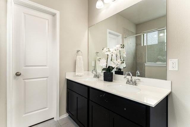 5014 Aspen Orchard Dr, Houston, TX 77066 - bathroom with double vanity, tiled shower, and tile patterned floors