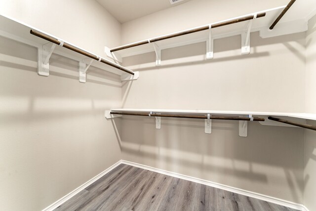 5014 Aspen Orchard Dr, Houston, TX 77066 - walk in closet featuring wood finished floors