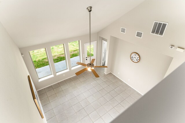 5014 Aspen Orchard Dr, Houston, TX 77066 - unfurnished living room featuring vaulted ceiling, light tile patterned floors, a ceiling fan, and baseboards
