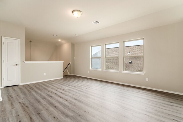 5014 Aspen Orchard Dr, Houston, TX 77066 - spare room with wood finished floors, baseboards, and lofted ceiling
