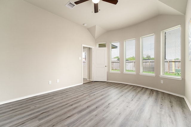 5014 Aspen Orchard Dr, Houston, TX 77066 - empty room with a ceiling fan, vaulted ceiling, wood finished floors, and baseboards