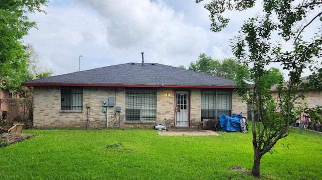5119 Kilkenny Dr, Houston, TX 77048 - rear view of house with a lawn and a shingled roof