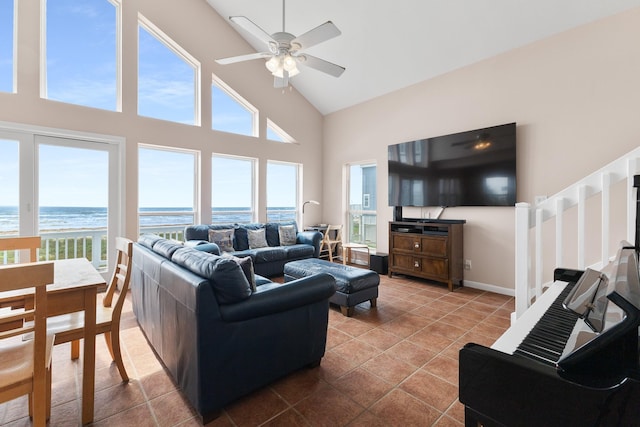 22915 Gulf Dr, Galveston, TX 77554 - living room featuring a ceiling fan, plenty of natural light, high vaulted ceiling, and tile patterned flooring