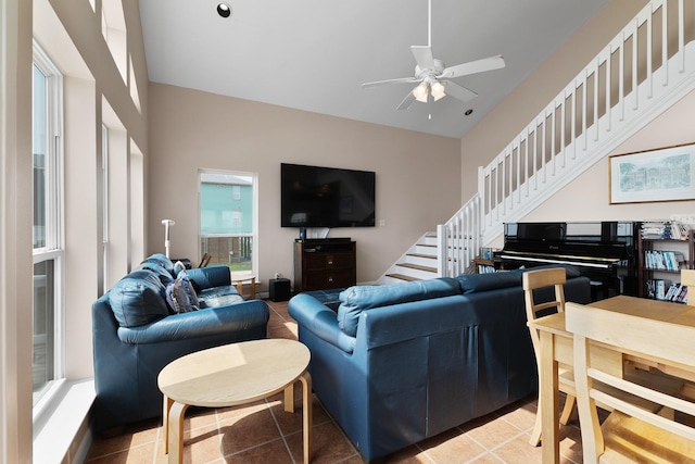 22915 Gulf Dr, Galveston, TX 77554 - living room with ceiling fan, stairway, and light tile patterned floors