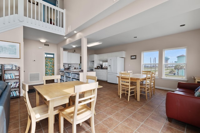 22915 Gulf Dr, Galveston, TX 77554 - dining space featuring baseboards, visible vents, recessed lighting, and light tile patterned flooring