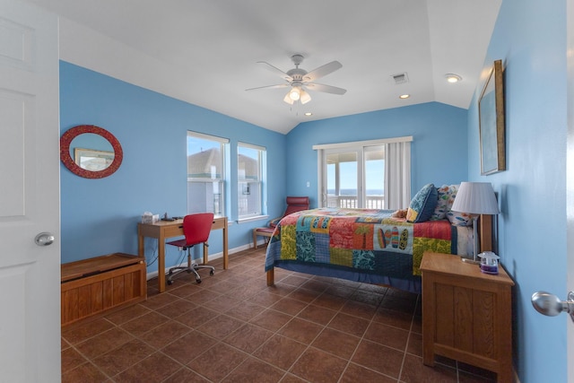 22915 Gulf Dr, Galveston, TX 77554 - bedroom with a ceiling fan, dark tile patterned floors, lofted ceiling, and visible vents