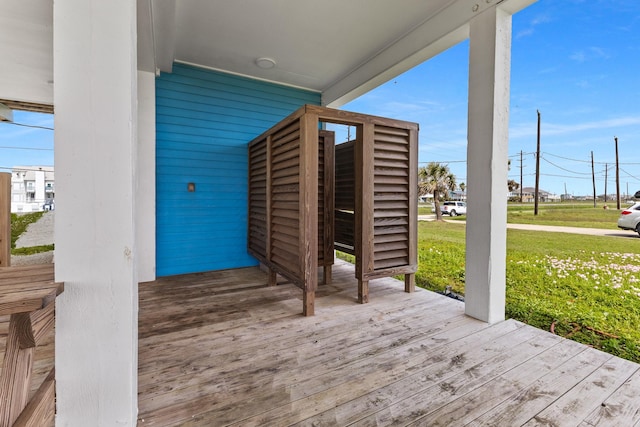 22915 Gulf Dr, Galveston, TX 77554 - wooden terrace featuring a lawn