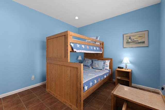 22915 Gulf Dr, Galveston, TX 77554 - bedroom featuring baseboards, dark tile patterned flooring, and recessed lighting