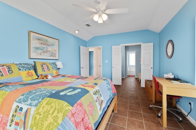 22915 Gulf Dr, Galveston, TX 77554 - bedroom with dark tile patterned flooring, visible vents, vaulted ceiling, and a ceiling fan