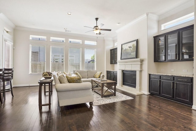 13217 Green Hills Dr, Houston, TX 77077 - living area with ceiling fan, ornamental molding, a glass covered fireplace, dark wood-style flooring, and plenty of natural light