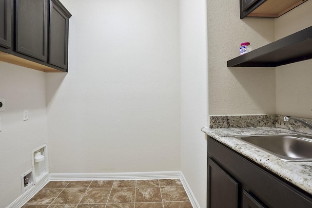 13217 Green Hills Dr, Houston, TX 77077 - laundry room with cabinet space, electric dryer hookup, baseboards, and washer hookup