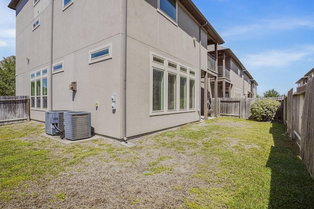 13217 Green Hills Dr, Houston, TX 77077 - rear view of property featuring central AC unit and stucco siding