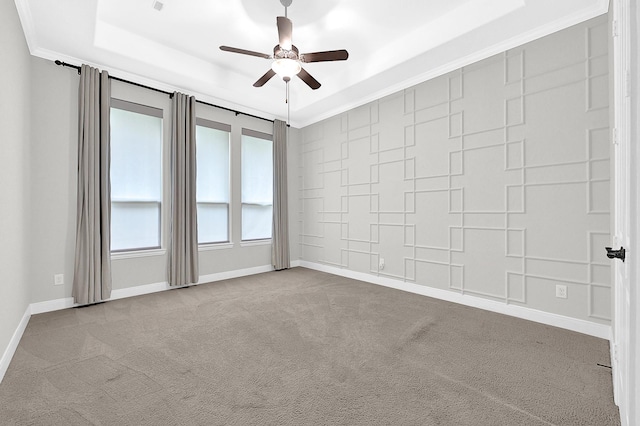 3411 Heather Garden Trl, Richmond, TX 77406 - carpeted spare room featuring ceiling fan, a tray ceiling, baseboards, and ornamental molding