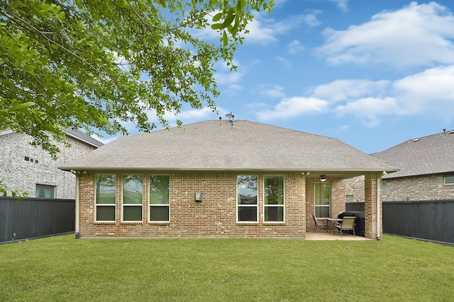 3411 Heather Garden Trl, Richmond, TX 77406 - back of house with a patio area, brick siding, and roof with shingles