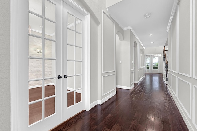 3411 Heather Garden Trl, Richmond, TX 77406 - hallway featuring french doors, dark wood-style flooring, baseboards, and crown molding