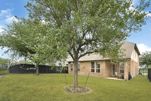 3411 Heather Garden Trl, Richmond, TX 77406 - rear view of property with brick siding, a patio, and a shingled roof