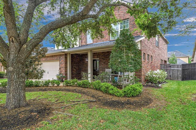 traditional-style home featuring brick siding