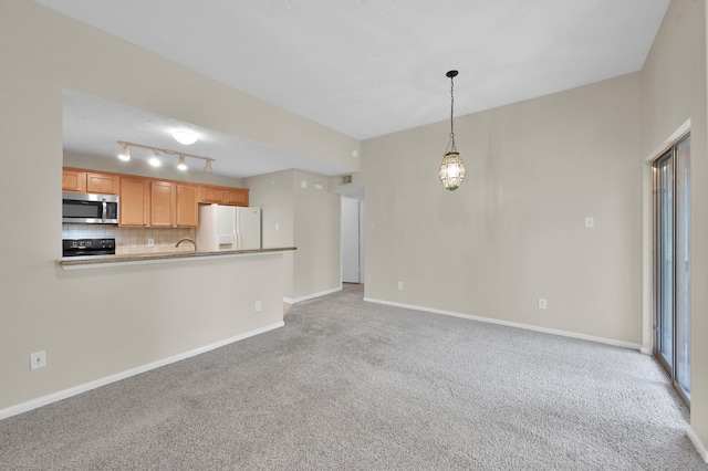 unfurnished living room with baseboards, visible vents, and light colored carpet