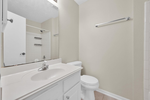 bathroom featuring tile patterned floors, toilet, a shower, vanity, and baseboards