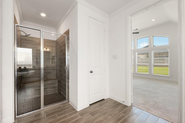 6518 Fairway Glen Ln, Katy, TX 77493 - bathroom with recessed lighting, wood tiled floor, a stall shower, baseboards, and ornamental molding