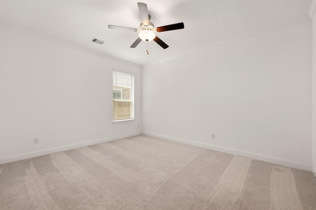 6518 Fairway Glen Ln, Katy, TX 77493 - spare room featuring light carpet, baseboards, visible vents, a ceiling fan, and crown molding