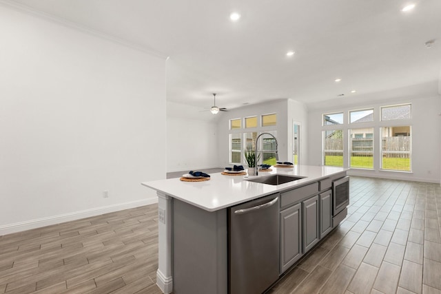6518 Fairway Glen Ln, Katy, TX 77493 - kitchen featuring gray cabinets, light wood-style floors, appliances with stainless steel finishes, a sink, and open floor plan